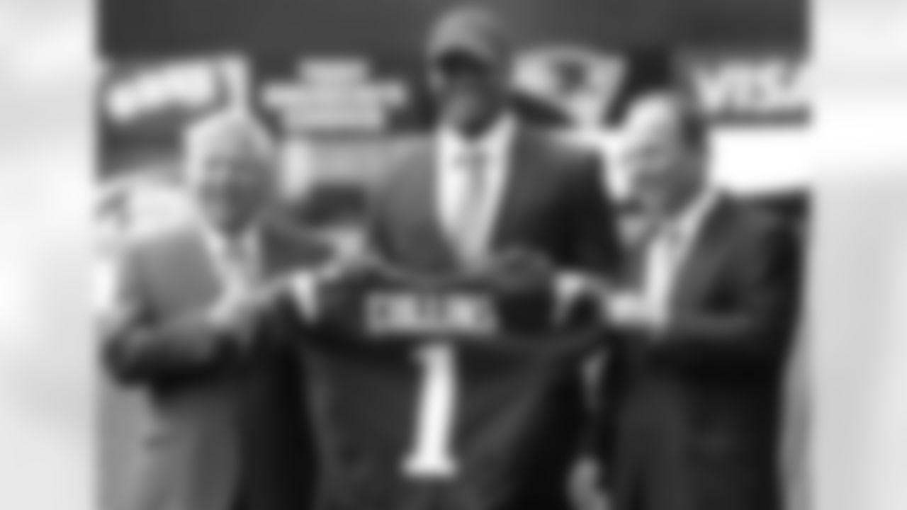 New England Patriots owner Robert Kraft, left, and team president Jonathan Kraft, right, present Jamie Collins, center, with a jersey representing the teams first pick of the 2013 NFL draft at Gillette Stadium, in Foxborough, Mass., Thursday, May 2, 2013. The Patriots took Collins with the 52nd overall pick, after coach Bill Belichick privately worked out for him. (AP Photo/Steven Senne)