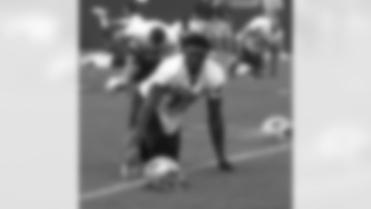 Rookie Chad Jackson(17) stretches during the in-stadium practice on day 5 of Training Camp. 8/1/2006 Photo by Elizabeth Propper