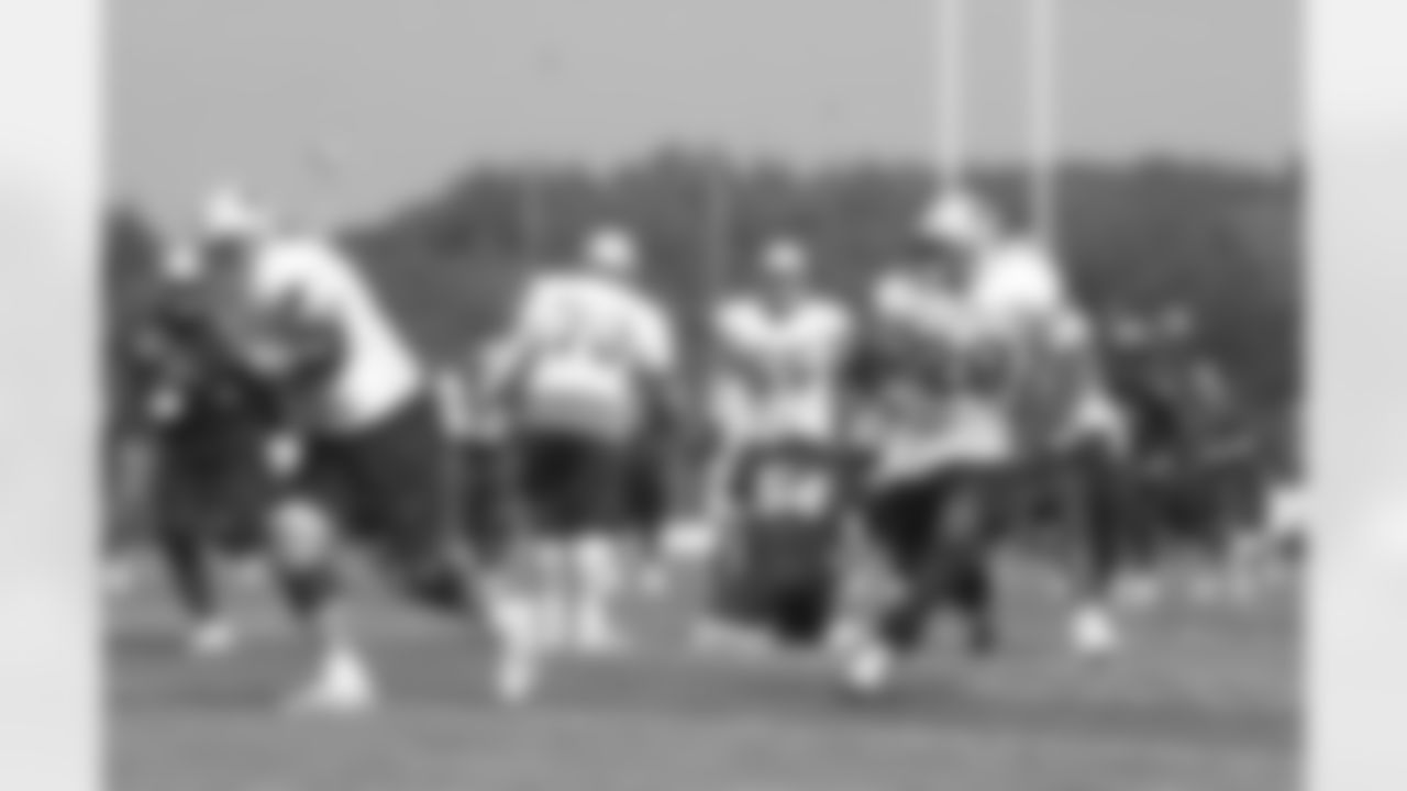 Patriots running back Corey Dillon(28) carries the ball during the afternoon practice session on day one of Training Camp. 7/28/2006 Photo by Elizabeth Propper