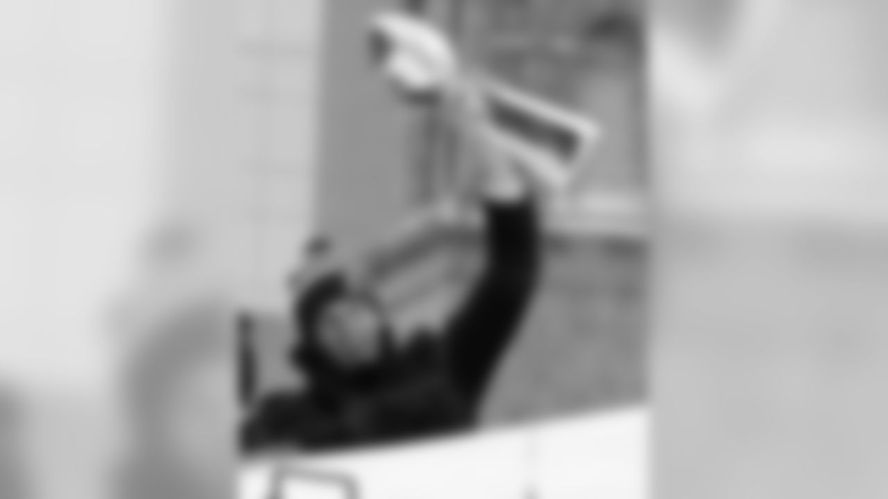 New England Patriots quarterback Tom Brady hoists a Lombardi Trophy during a parade in Boston Wednesday, Feb. 4, 2015, to honor the NFL football teams victory over the Seattle Seahawks in Super Bowl XLIX in Glendale, Ariz.(AP Photo/Charles Krupa)