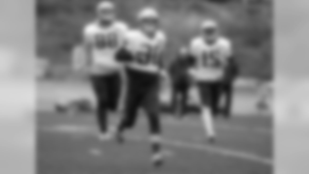 New England Patriots wide receiver Danny Amendola, center, warms up on the field with tight end Scott Chandler, left, and wide receiver Damaris Johnson, right, during an NFL football practice, Wednesday, Dec. 9, 2015, in Foxborough, Mass. The Patriots are to play the Houston Texans Sunday, Dec. 13, in Houston. (AP Photo/Steven Senne)