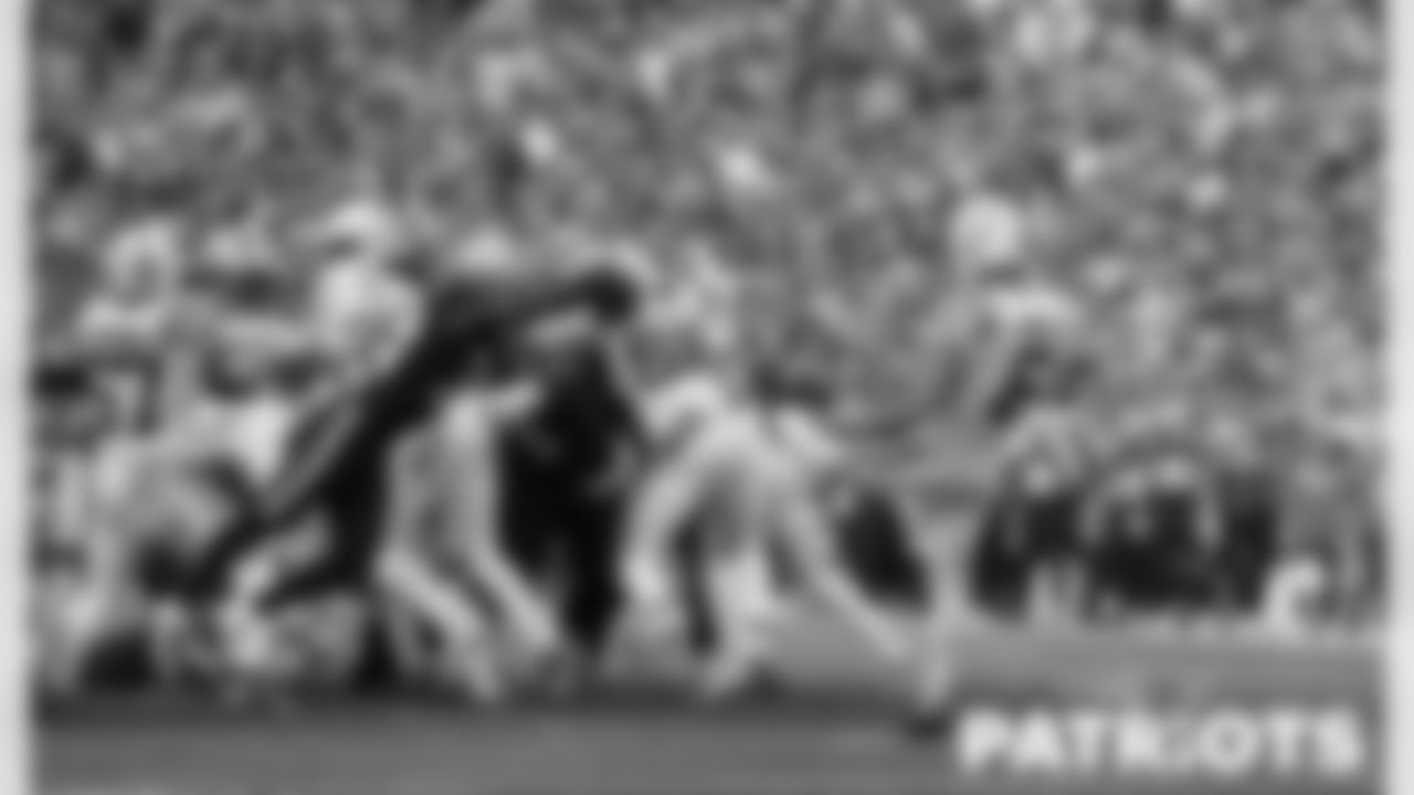 Patriot's DB Jonathan Jones diving to block a punt