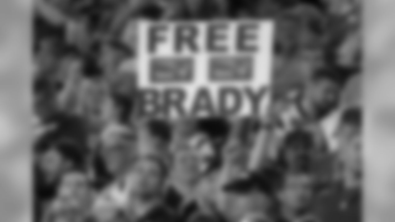 A New England Patriots fan holds a sign referring to Patriots quarterback Tom Brady during the second half of an NFL football game against the Houston Texans Thursday, Sept. 22, 2016, in Foxborough, Mass. (AP Photo/Elise Amendola)