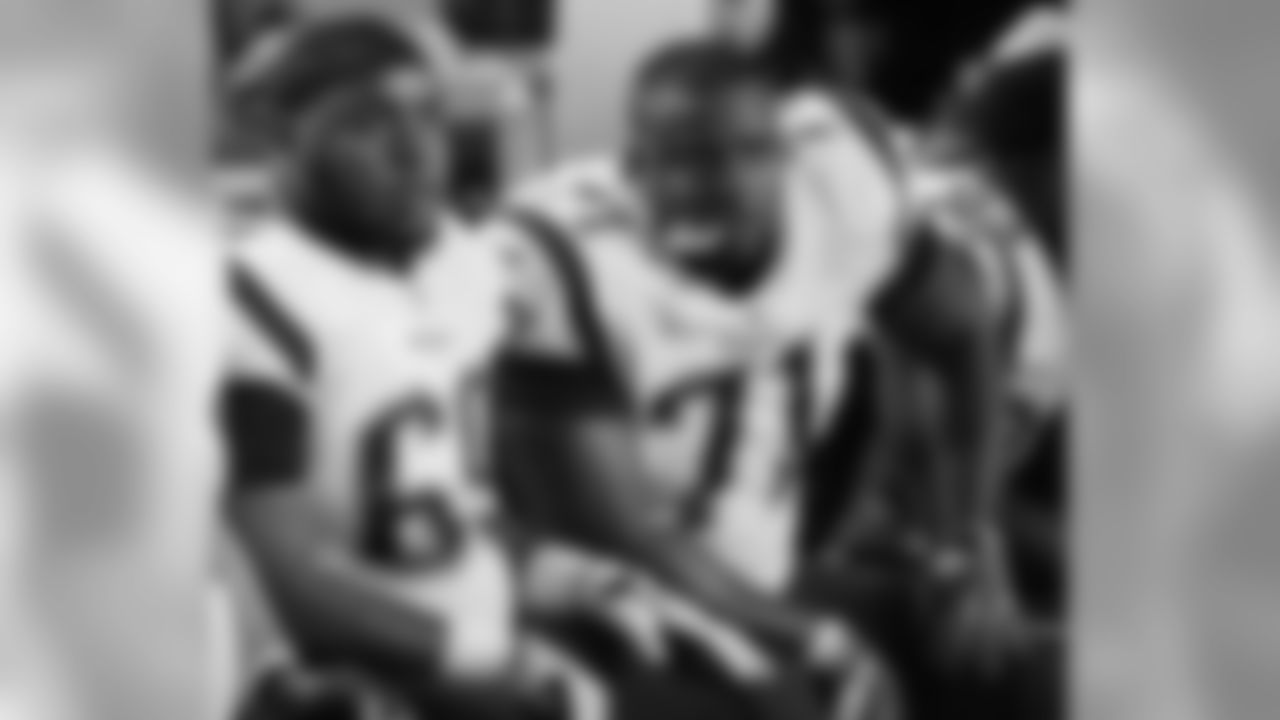 New England Patriots offensive guard Shaq Mason (69) and offensive tackle Cameron Fleming (71) watch the game from the sidelines, during the first half of an NFL football game against the Miami Dolphins, Monday, Dec. 11, 2017, in Miami Gardens, Fla. (AP Photo/Lynne Sladky)