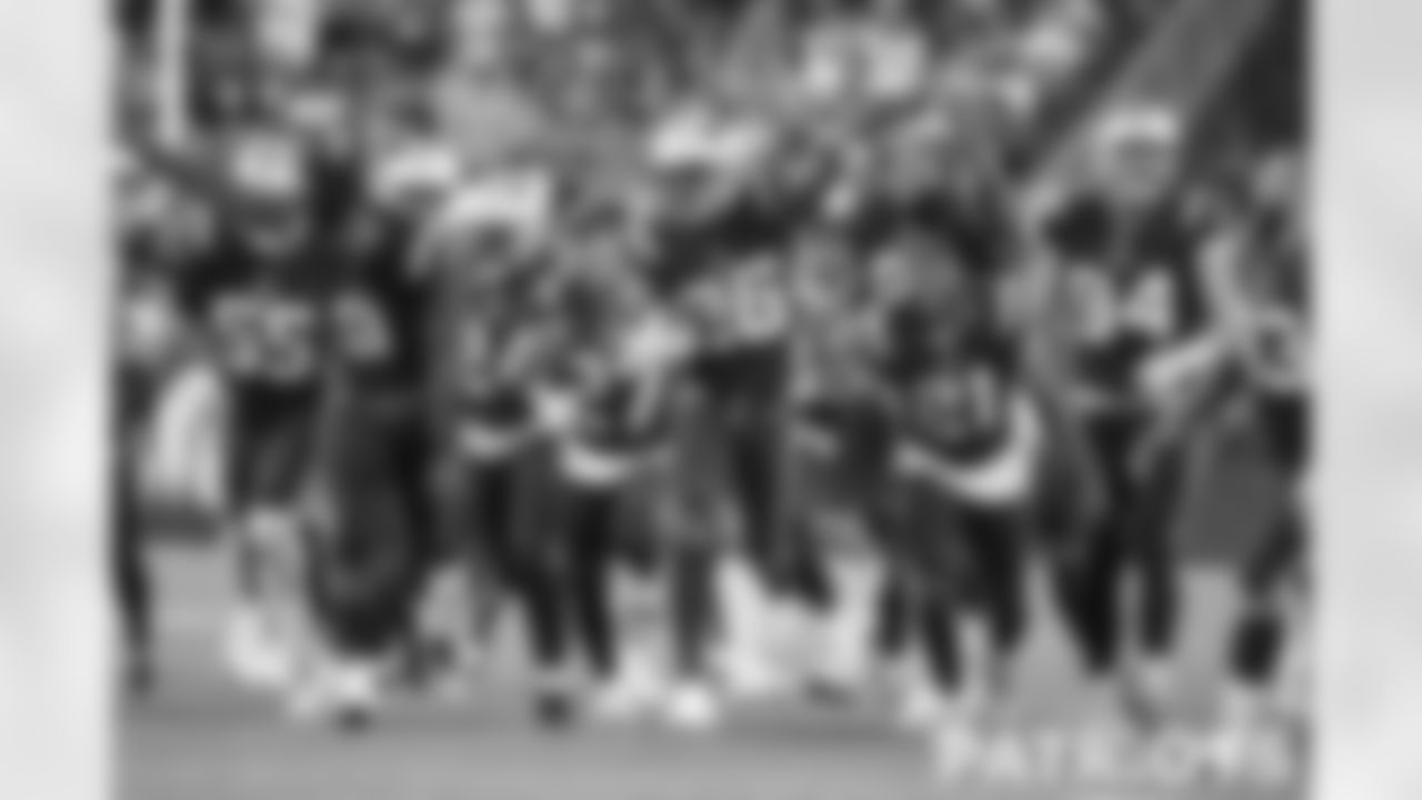 Team celebration after a interception by Shaun Wade (26)