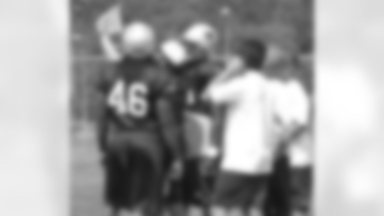 Linebackers receive instructions during the afternoon practice on
Day 4 of Training Camp. 7/31/2006 Photo by Elizabeth Propper