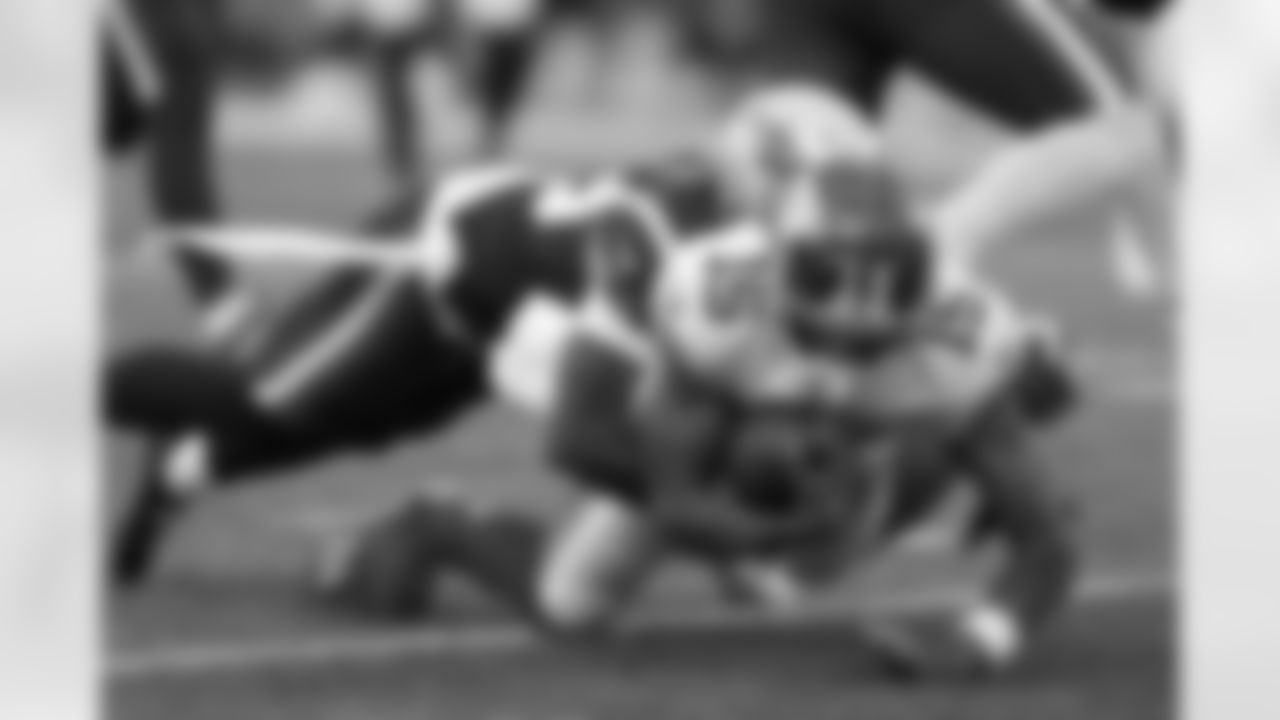 New York Giants wide receiver Collin Johnson (15) is brought down by New England Patriots cornerback Terrance Mitchell.