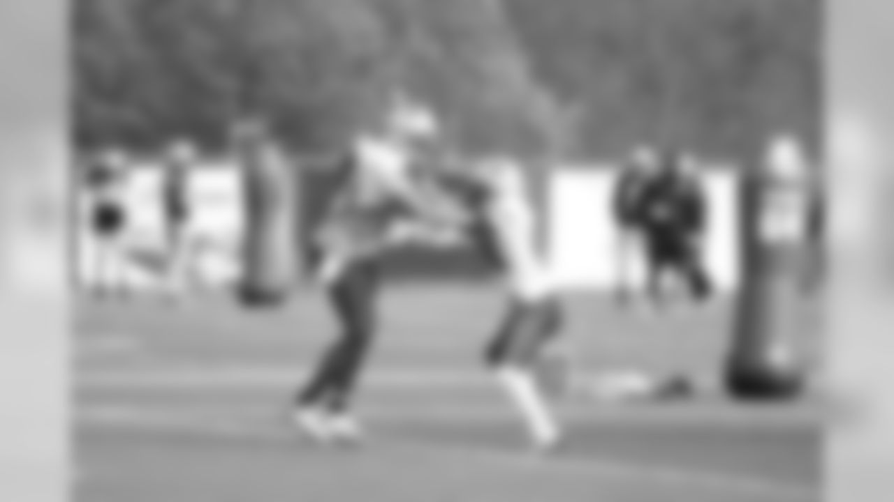 Wide Receivers working on blocking technique