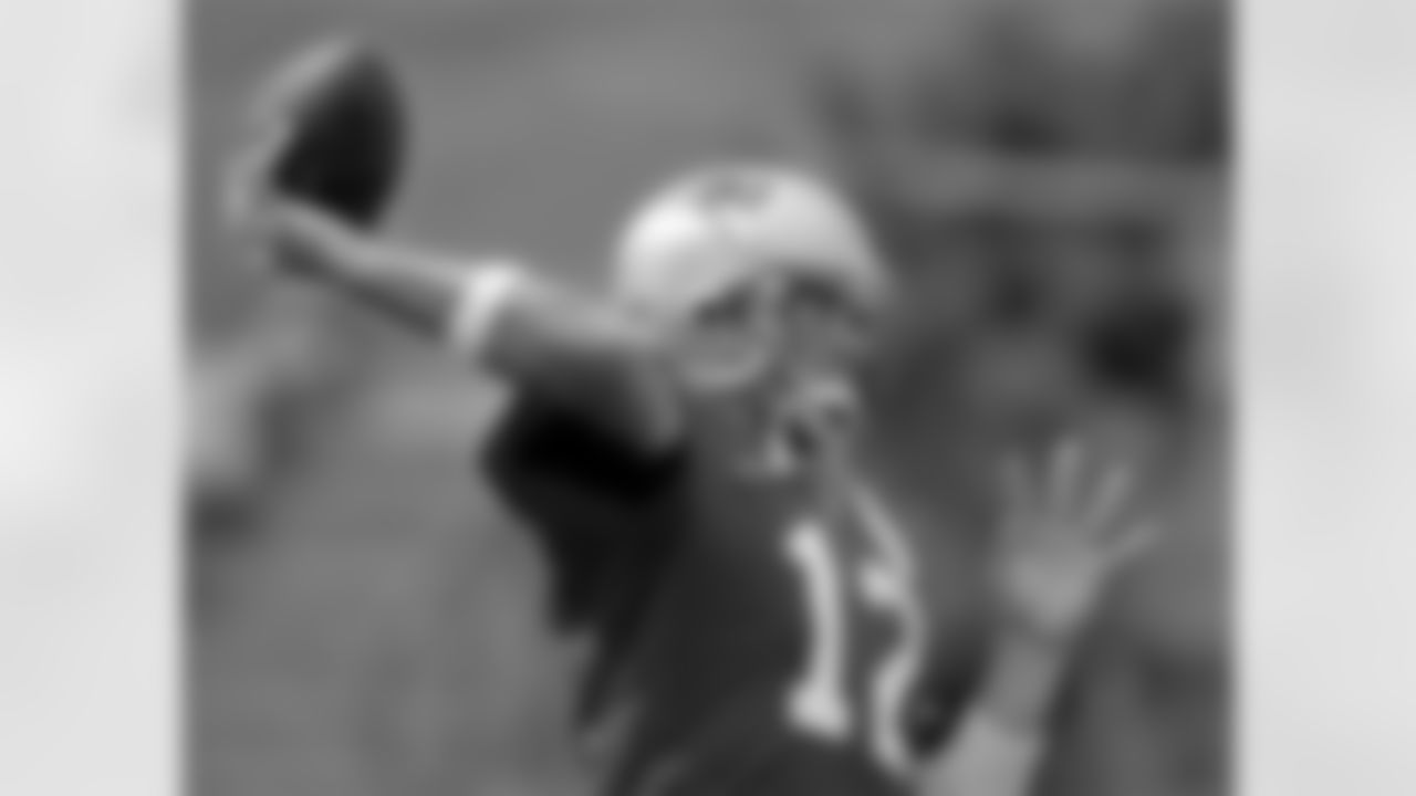 Patriots quarterback Tom Brady (12), who turned 29 on Thursday, throws a pass during the afternoon session of the team's summer football camp in Foxborough, Mass., Friday Aug. 4, 2006. Photo by Stephan Savoia