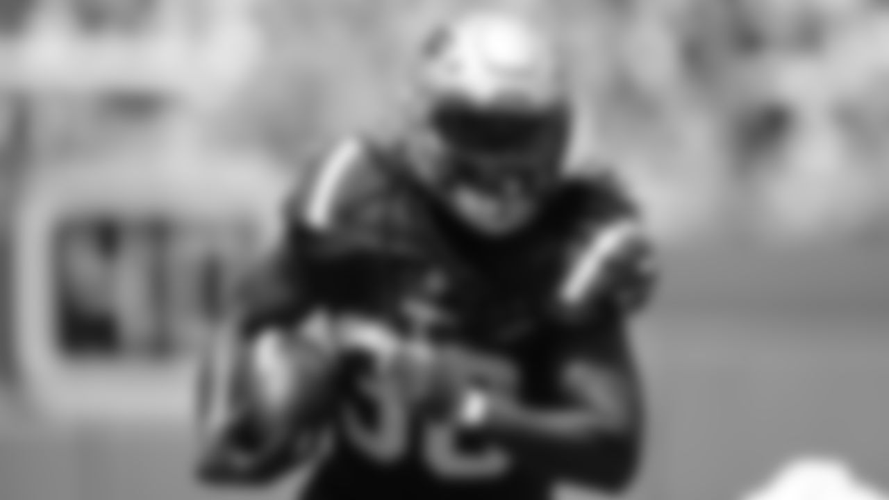 Rhamondre Stevenson (38) rushes for a gain against the Miami Dolphins