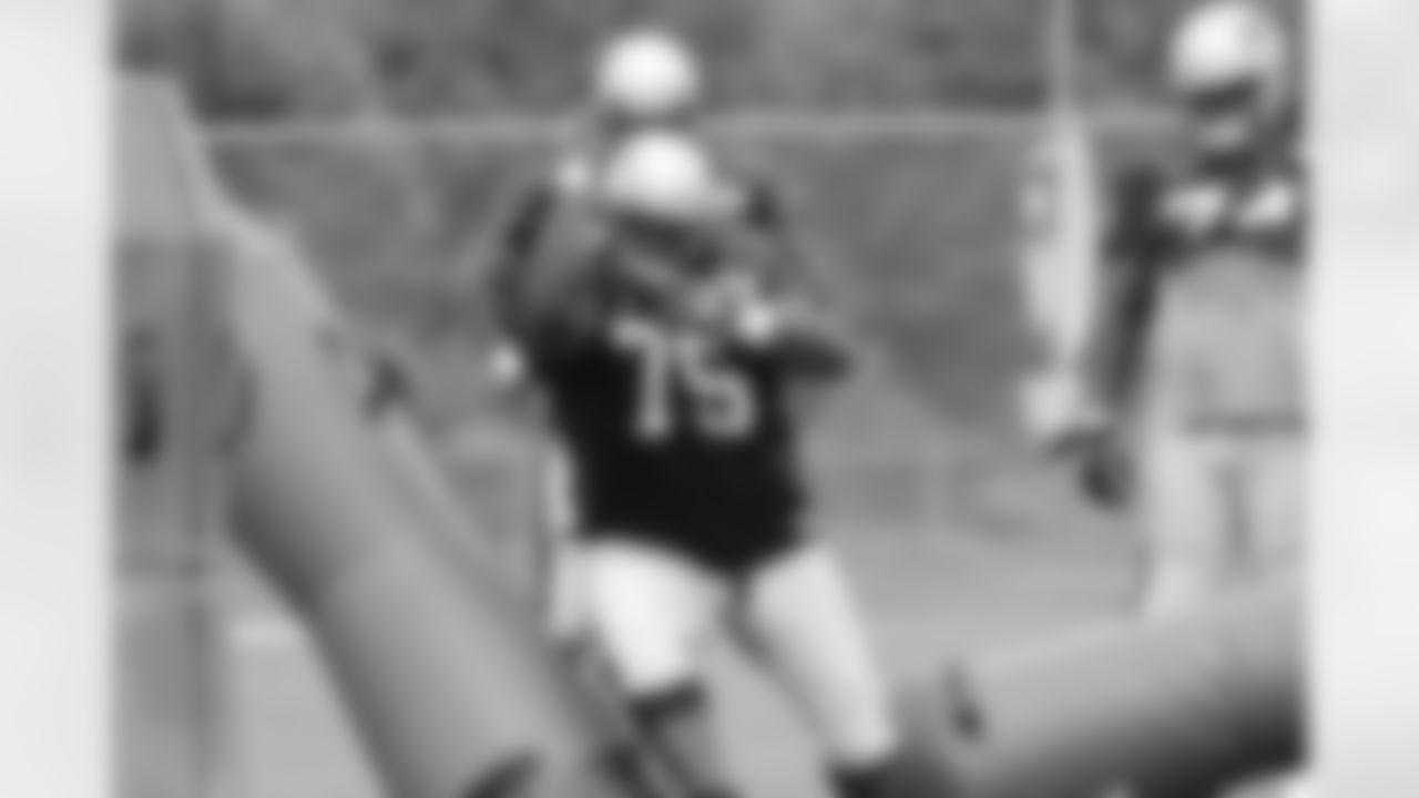 Vince Wilfork runs though a drill at training camp
