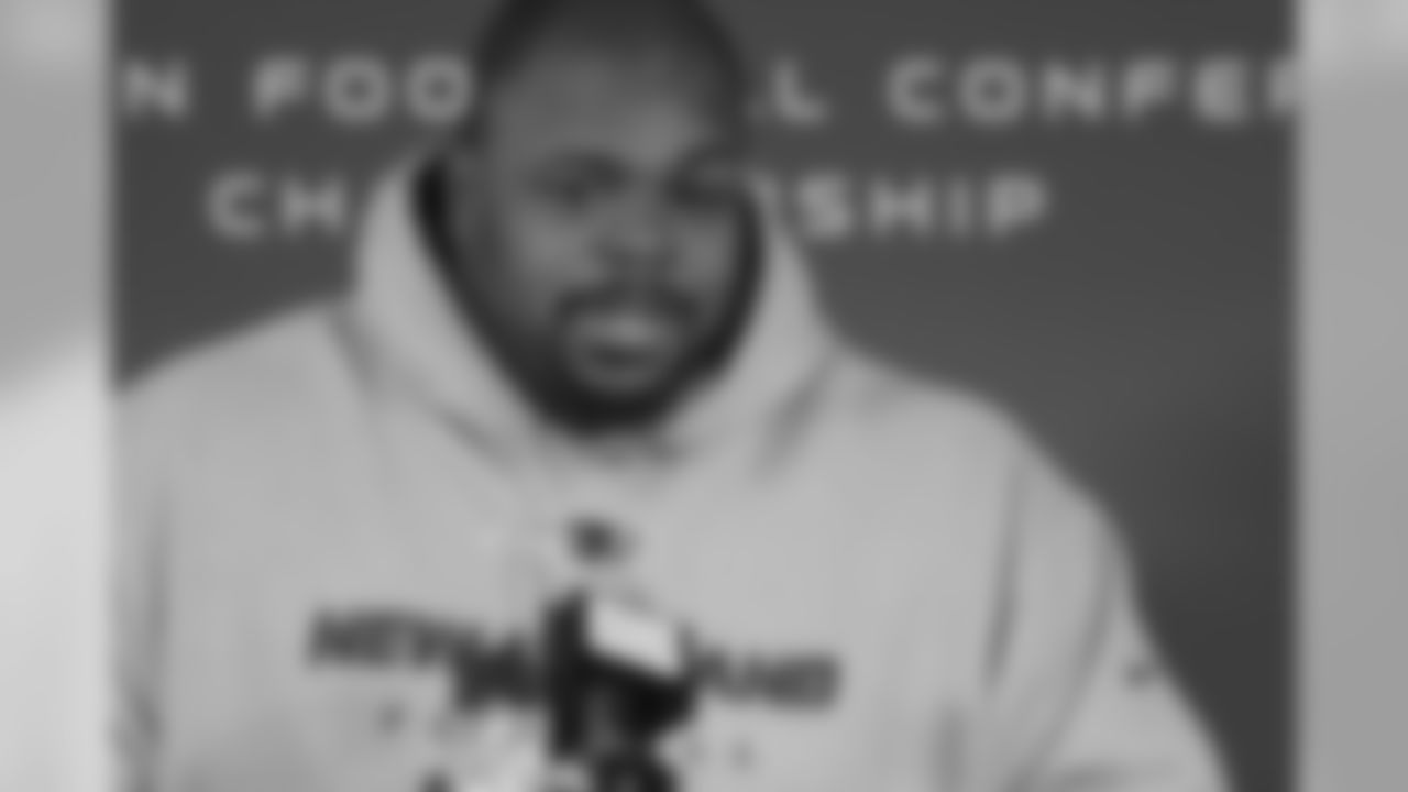 Vince Wilfork talks with the media
