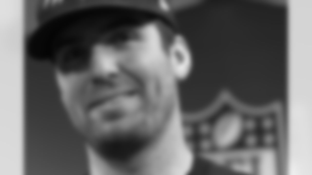 Ravens QB Joe Flacco talks with the media