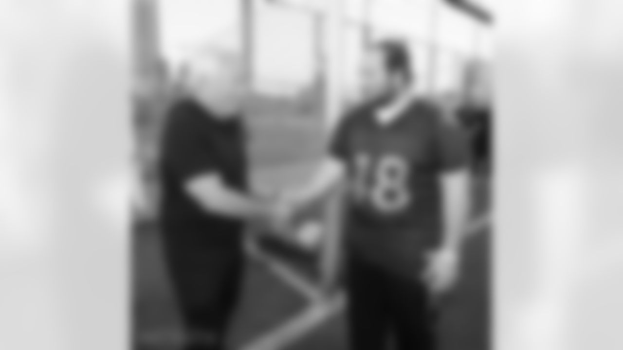 Robert Kraft greets a member of the Israeli football League.