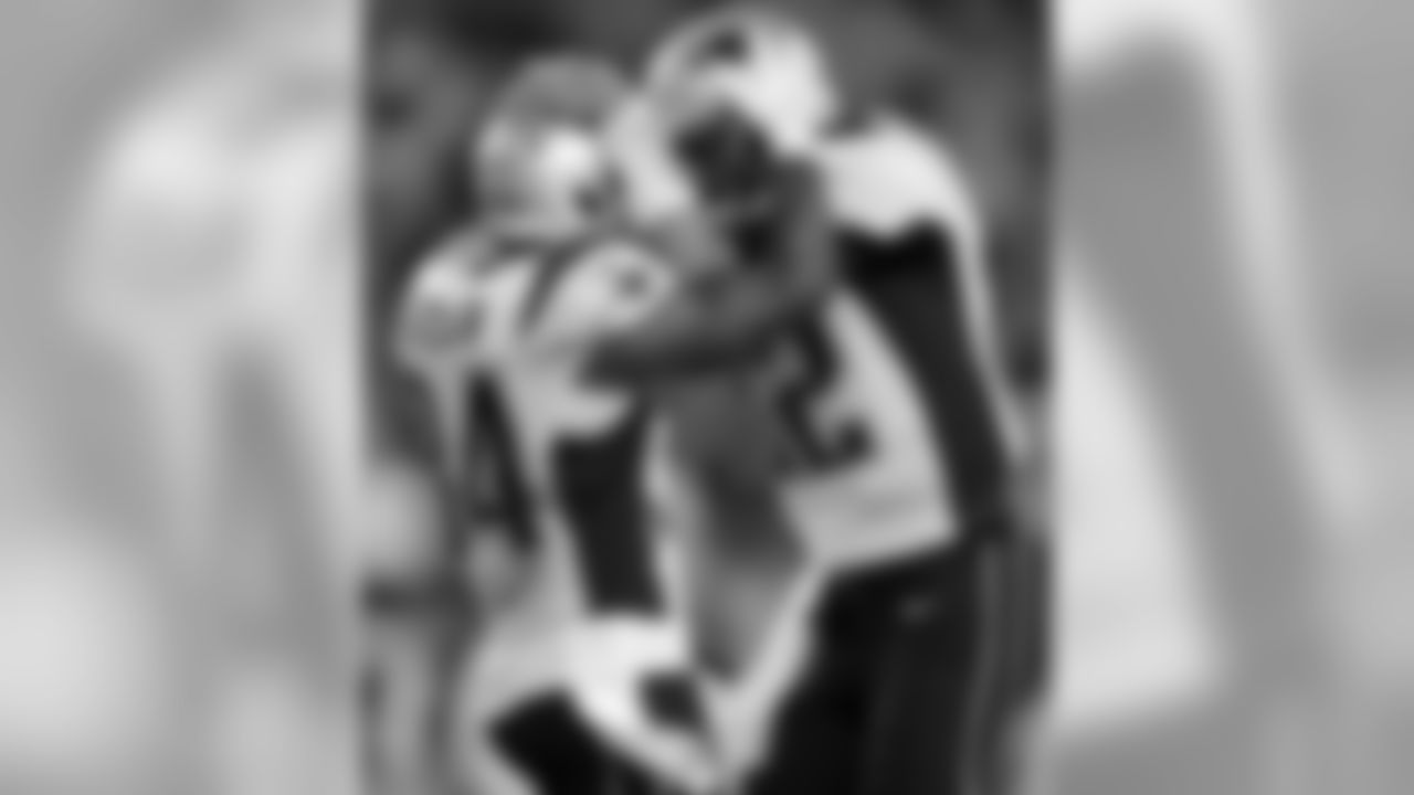 New England Patriots running back Shane Vereen, left, celebrates his touchdown with quarterback Tom Brady in the first half of an NFL preseason football game against the Carolina Panthers, Friday, Aug. 22, 2014, in Foxborough, Mass. (AP Photo/Charles Krupa)
