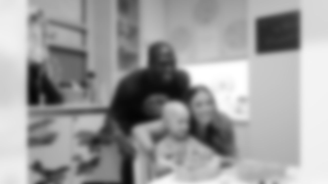BOSTON, MA - JULY 28: New England Patriots player Devin McCourty takes a picture with London and Mom at Boston Children's Hospital July 28, 2015 in Boston, Massachusetts. (Photo by Darren McCollester/Getty Images for Boston Children's Hospital)