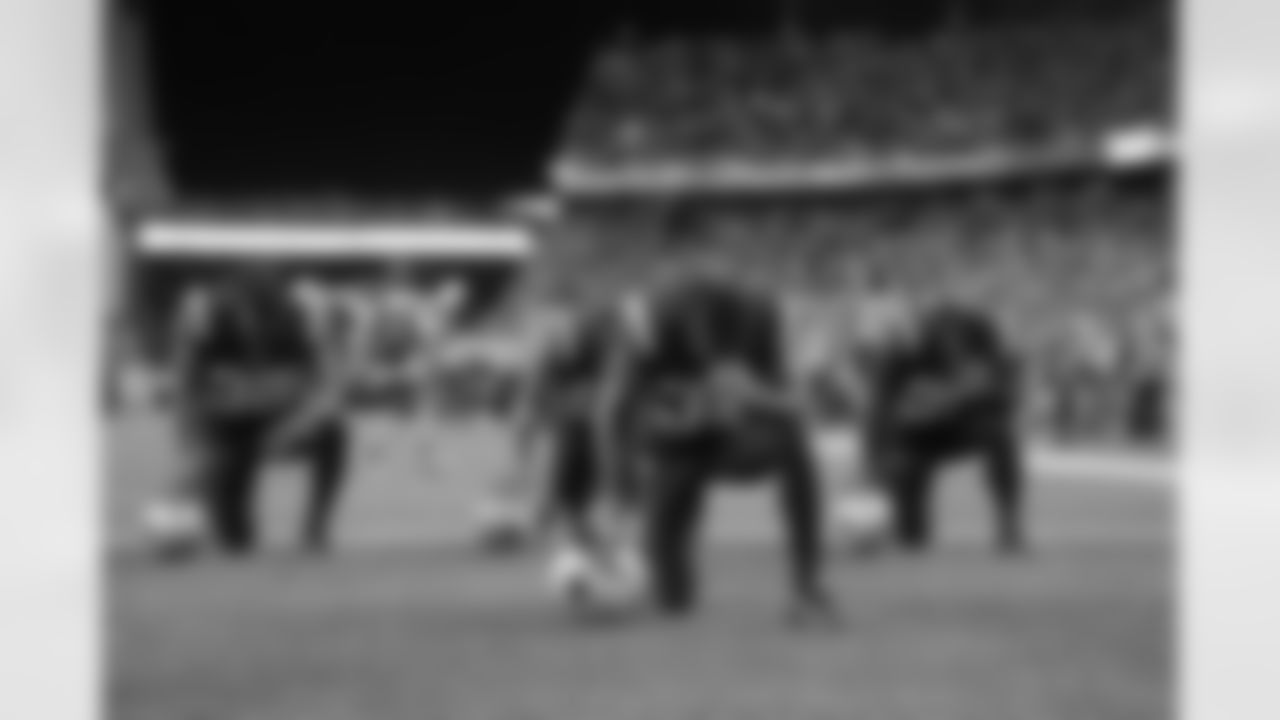 New England Patriots players take a knee in the end zone before an NFL football game against the Houston Texans Thursday, Sept. 22, 2016, in Foxborough, Mass. (AP Photo/Elise Amendola)