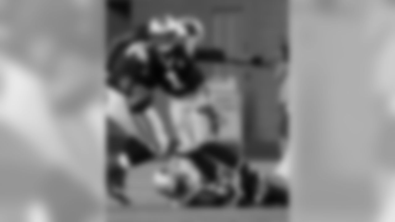New England Patriots defensive end Chandler Jones, bottom, sacks Carolina Panthers quarterback Cam Newton in the first half of an NFL preseason football game Friday, Aug. 22, 2014, in Foxborough, Mass. (AP Photo/Stephan Savoia)