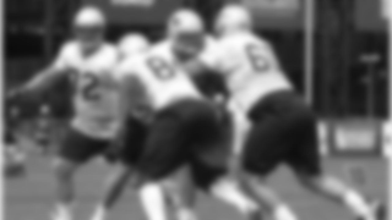 Players run offensive drills on Day 8 of Training Camp. 8/4/2006 Photo by Elizabeth Propper