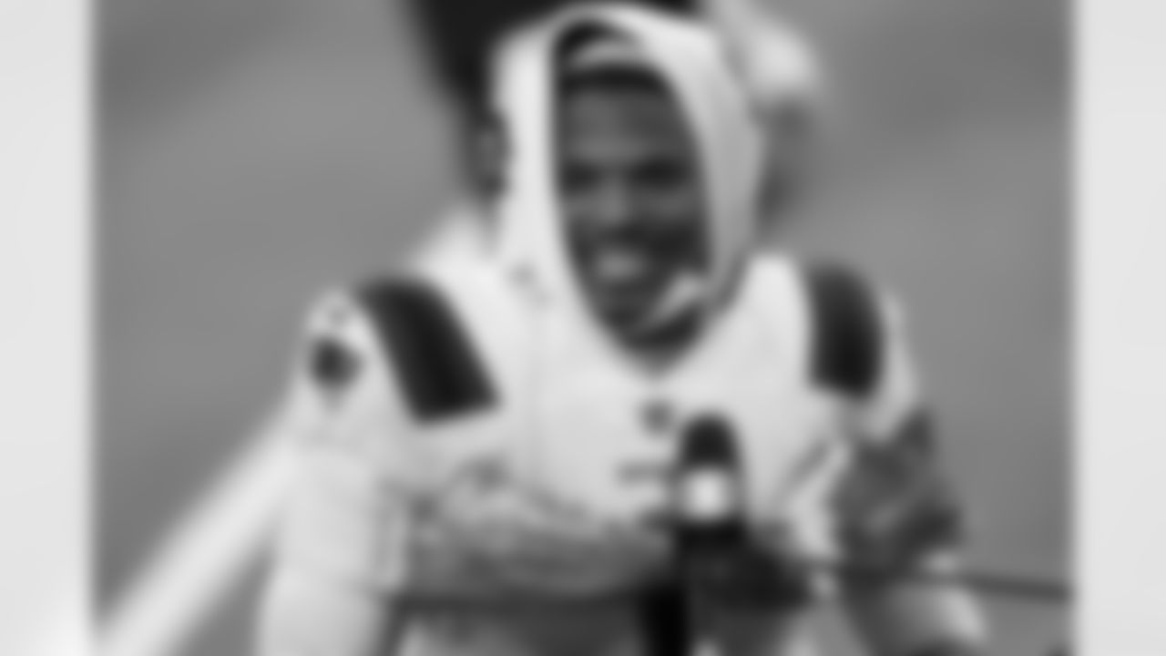 New England Patriots quarterback Cam Newton smiles as he conducts an interview at the end of an NFL football game against the Los Angeles Chargers Sunday, Dec. 6, 2020, in Inglewood, Calif. (AP Photo/Ashley Landis)