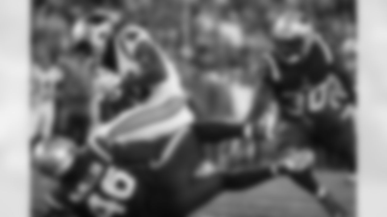 Carolina Panthers running back Spencer Brown, top left, is brought down by New England Patriots linebacker Raekwon McMillan (46)