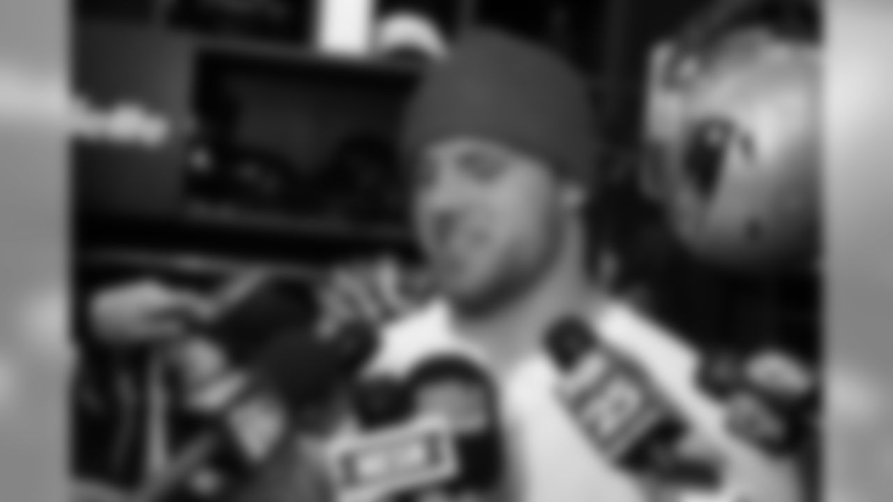 James Develin addresses the media in the locker room