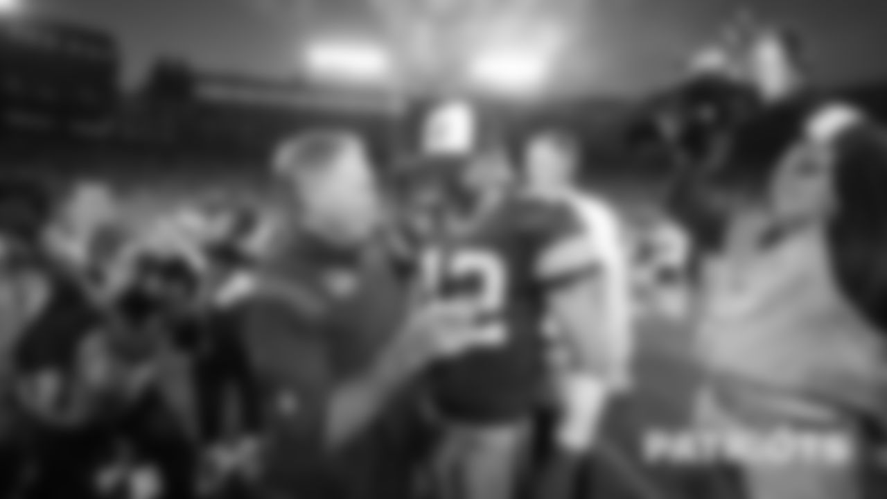 Patriots head coach Bill Belichick talks with Packers quarterback Aaron Rodgers after the game.