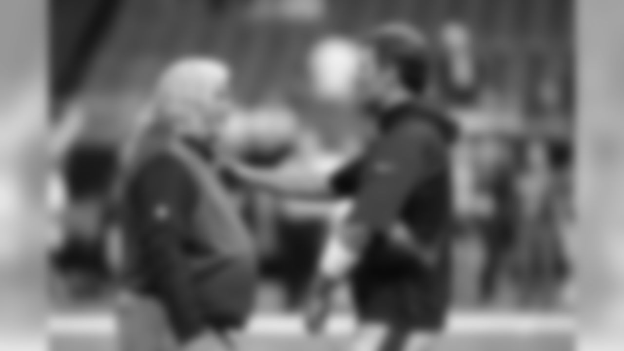 New England Patriots quarterback Tom Brady, right, talks with New Orleans Saints defensive coordinator Rob Ryan before an NFL football game in New Orleans, Saturday, Aug. 22, 2015. (AP Photo/Bill Feig)