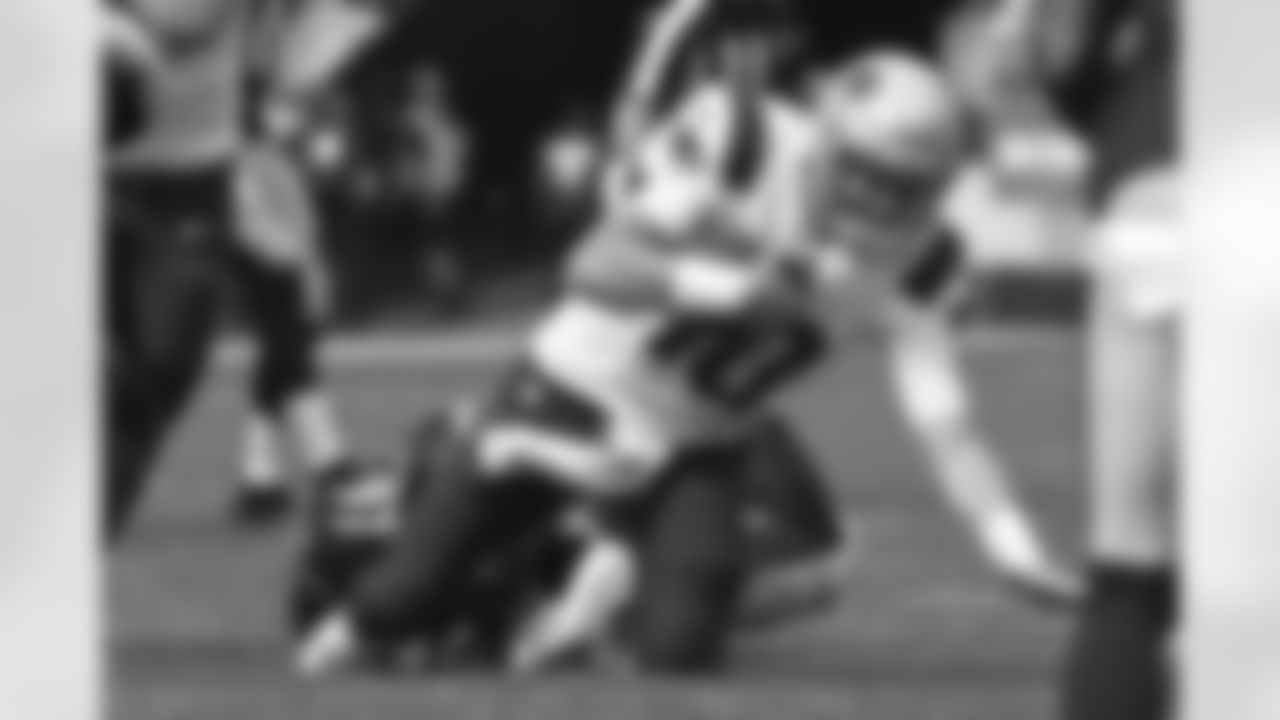 New England Patriots quarterback Mac Jones (10) is tackled by Pittsburgh Steelers defensive tackle Cameron Heyward (97)