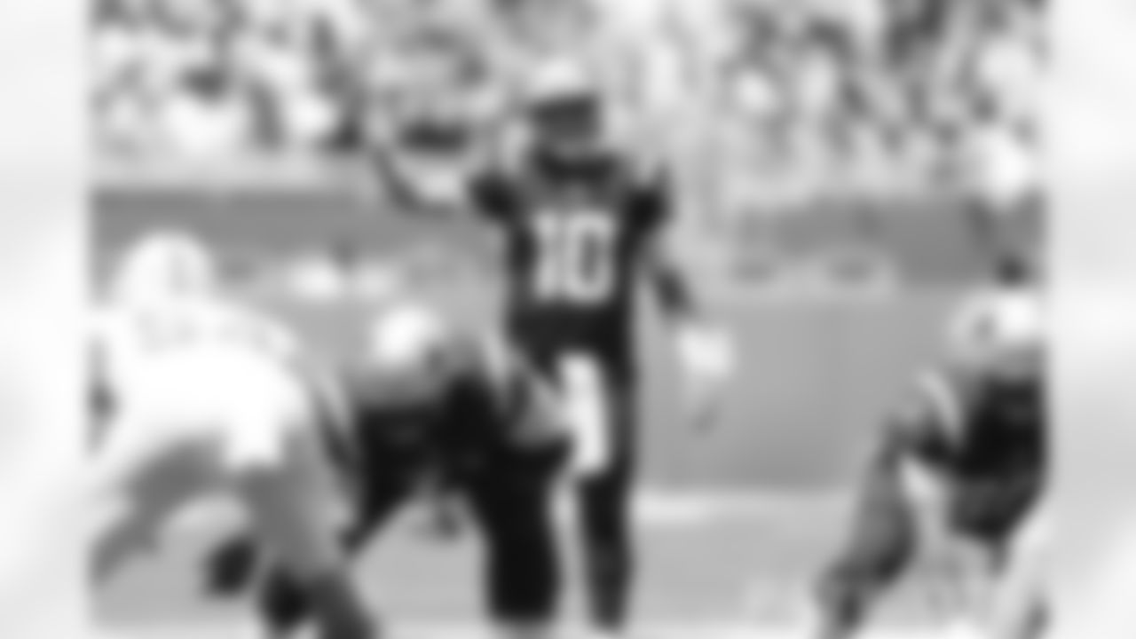 Mac Jones (10) signaling pre-snap against the Miami Dolphins