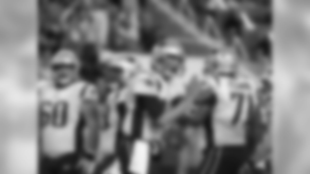 New England Patriots quarterback Tom Brady (12) cheers the offensive line on the field, during the second half of an NFL football game against the Miami Dolphins, Monday, Dec. 11, 2017, in Miami Gardens, Fla. (AP Photo/Lynne Sladky)