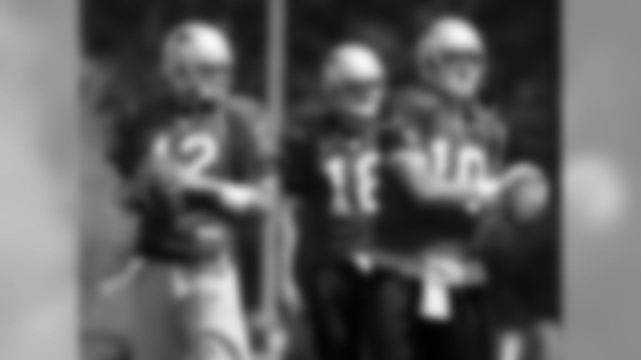 New England Patriots quarterbacks Tom Brady (12), Matt Cassel(16), center, and Corey Bramlet(10), right, are seen together during the team's summer football camp. 8/9/2006 Photo by Chitose Suzuki