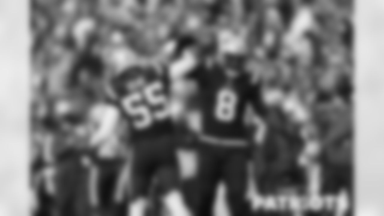 Ja"whaun Bentley and Josh Uche celebrating after a defensive stop