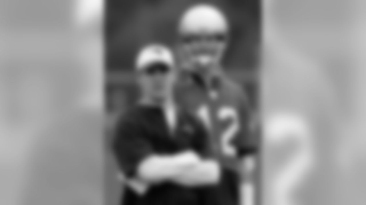New England Patriots quarterback Tom Brady and offensive coordinator/quarterbacks coach John McDaniels watch as the second team works during the morning session of the third and final day of Patriots football mini camp in Foxbrough, Mass., Thursday June 15, 2006. Photo by Stephan Savoia