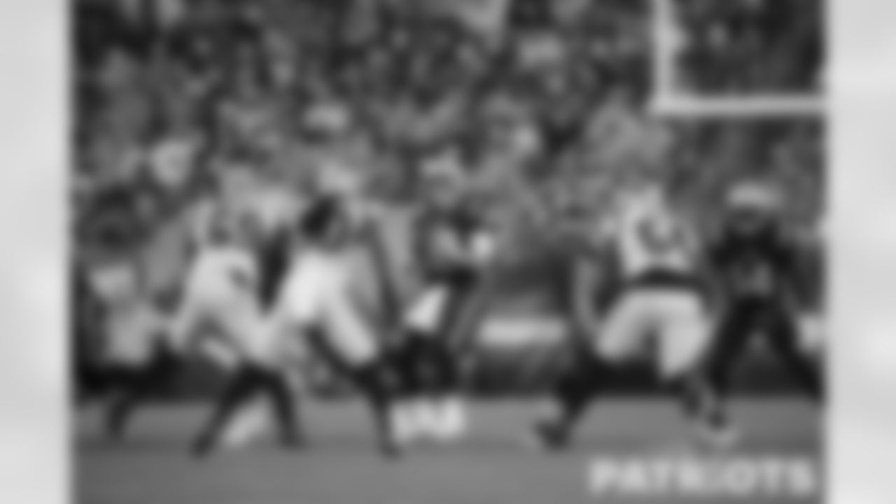 Bailey Zappe (4) drops back against the Carolina Panthers defense