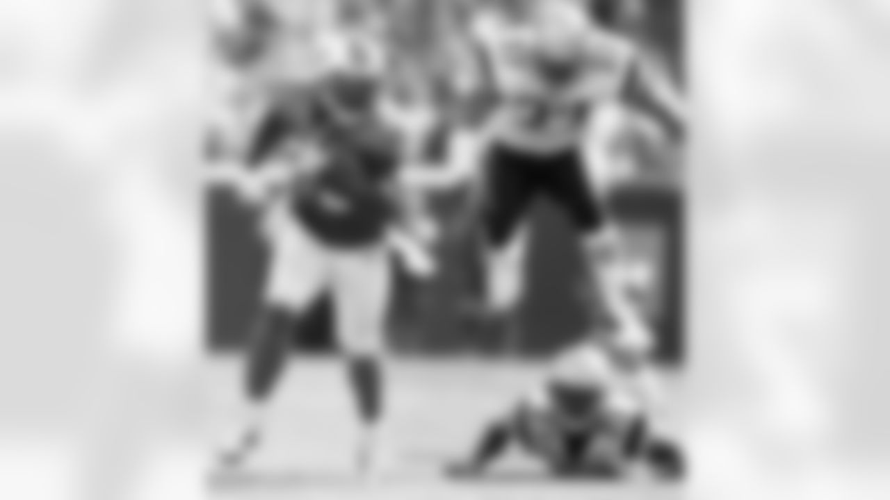 Dolphins RB Ronnie Brown rushed for a team-record four touchdowns and threw for another as Miami unleashed the "wildcat" offense and cruised to a 38-13 win on Sept. 21, 2008.