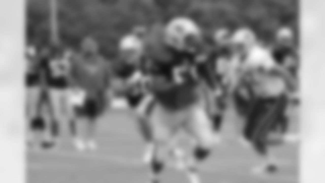 Jerod Mayo runs through a practice during training camp