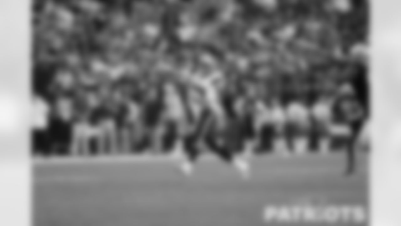 Mac Jones (10) throws on the run