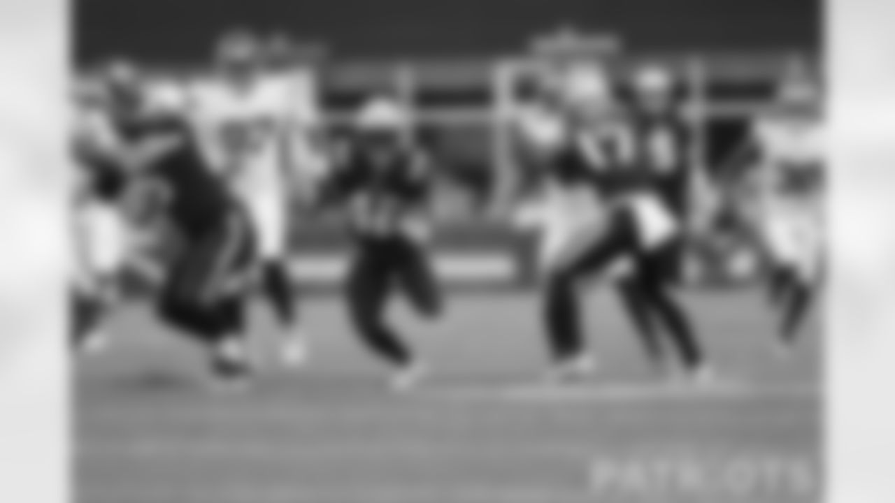 RB J.J. Taylor moves down the field