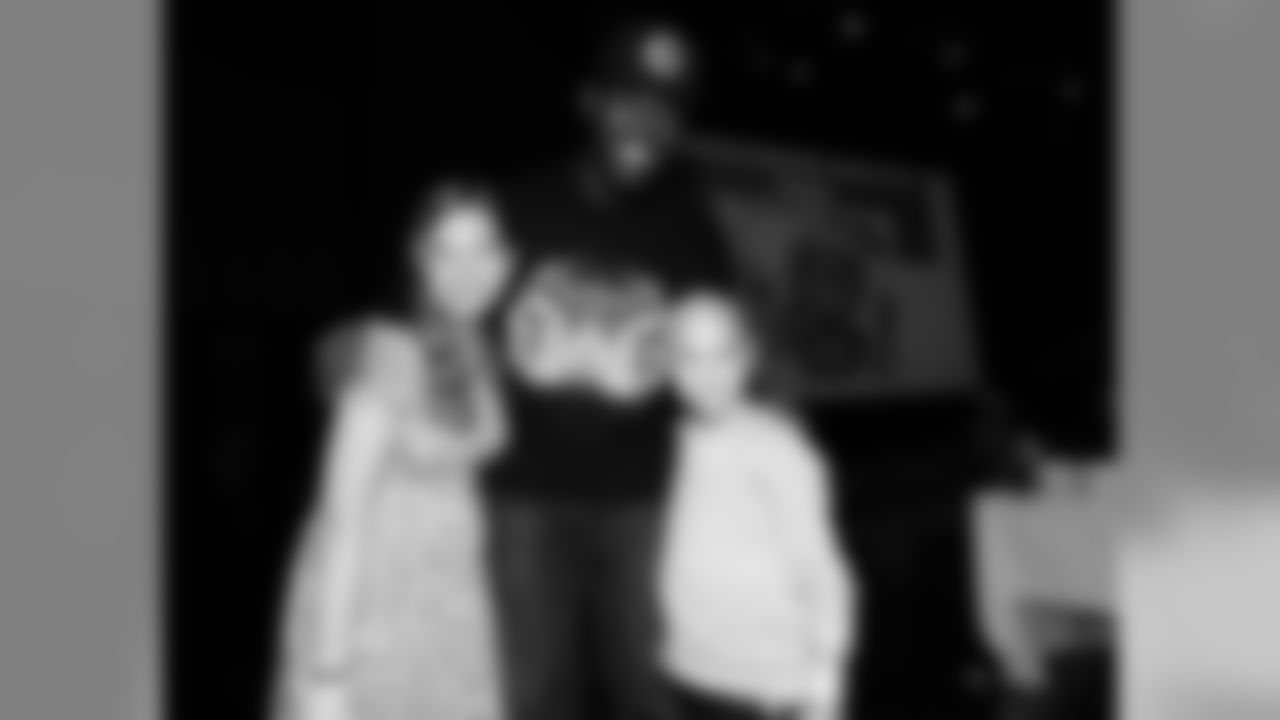 FOXBOROUGH, MA - DECEMBER 15: New England Patriots Chandler Jones poses for pictures with Madison and Camryn during Patrick ChungÕs Open Mic Holiday Party benefiting Boston Children's Hospital at Patriot Place December 15, 2014 in Foxborough, Massachusetts. (Photo by Darren McCollester/Getty Images for Boston Children's Hospital) * Local Caption * Chandler Jones