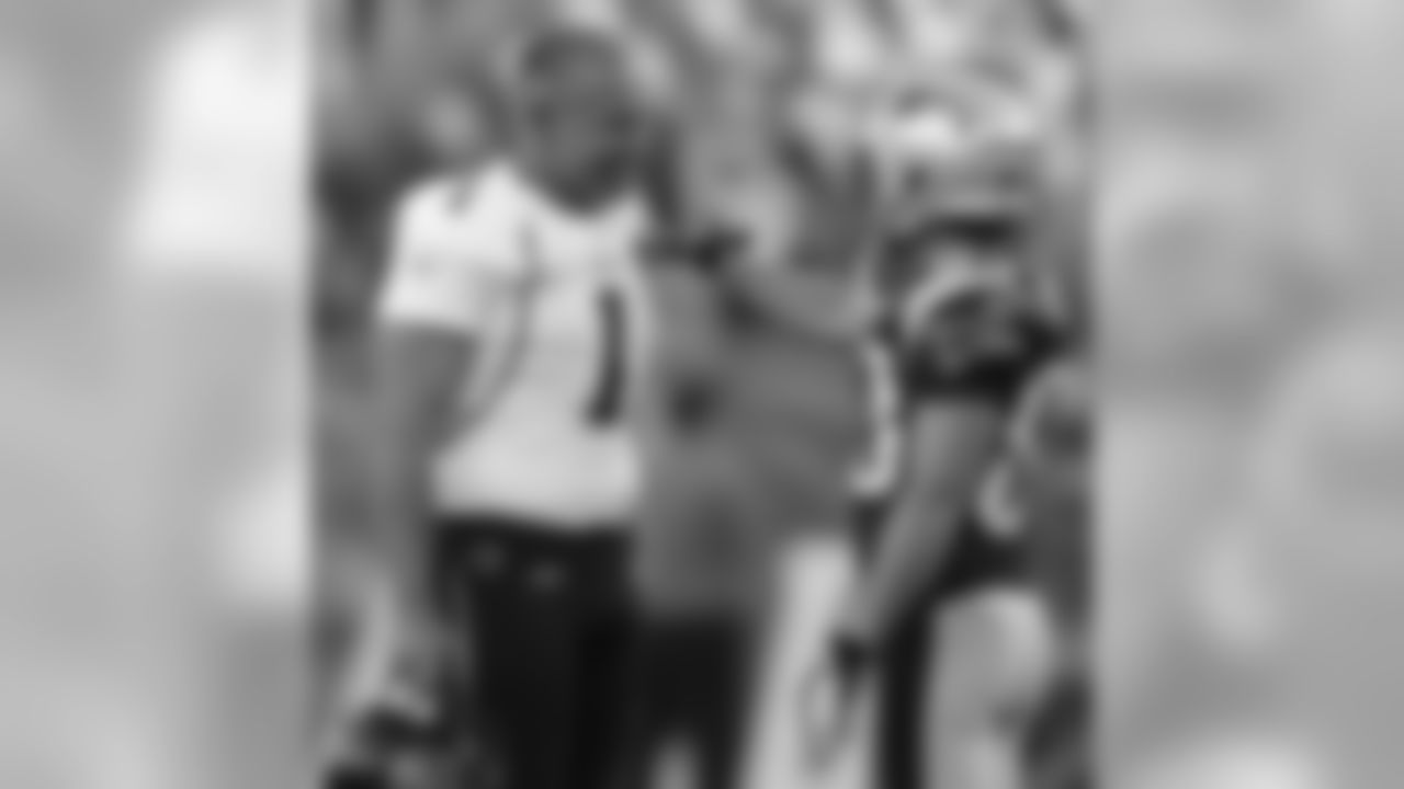 New England Patriots wide receiver Wes Welker (83) and Jacksonville Jaguars punter Matt Turk (1) talk before an NFL preseason football game in Foxborough, Mass., Thursday night, Aug. 11, 2011. (AP Photo/Elise Amendola)
