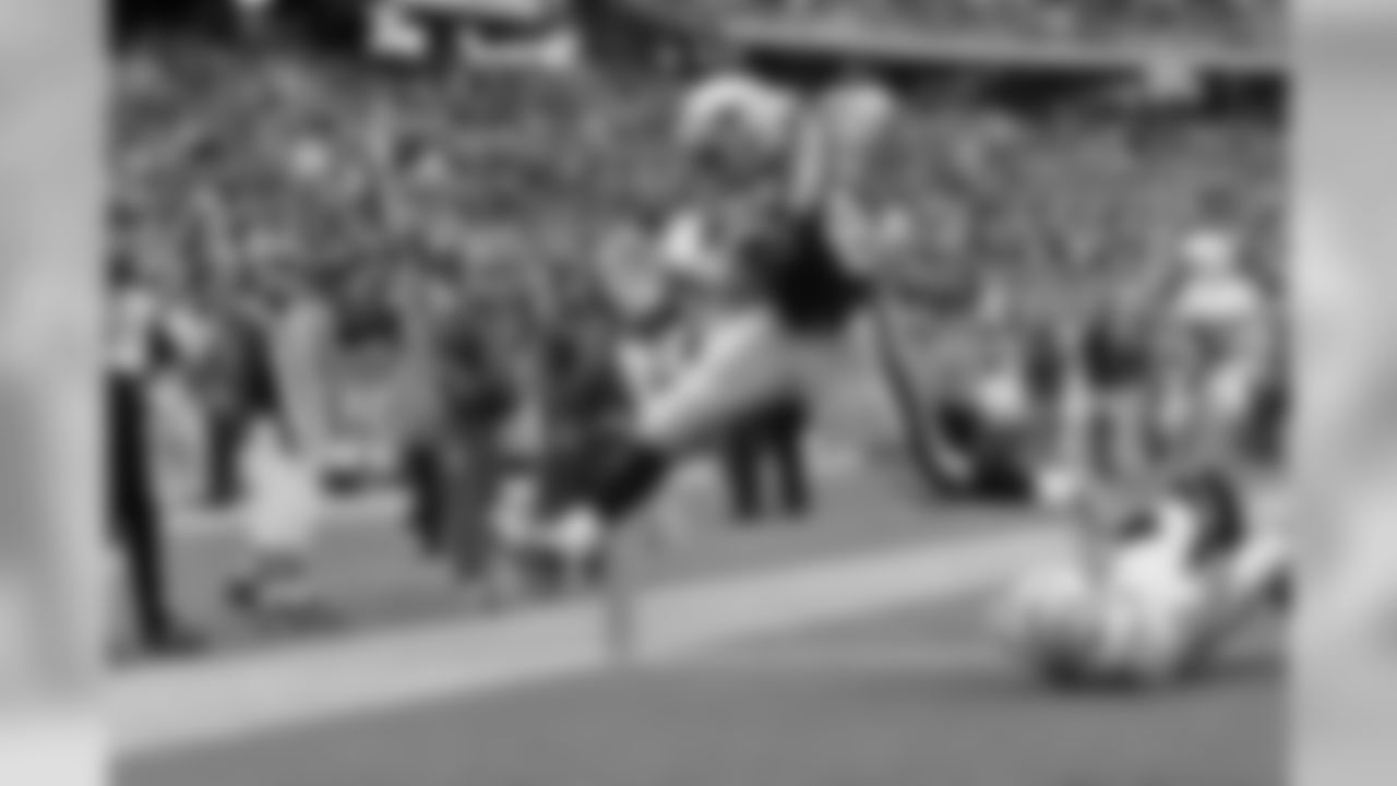 Patriots TE Rob Gronkowski rumbles over a deffender for one of his three touchdowns