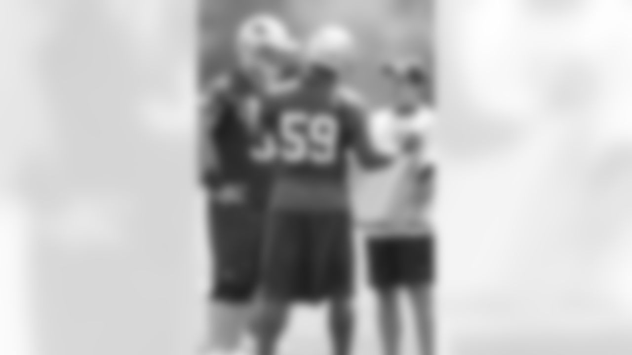 Patriots head coach Bill Belichick talks with linebacker Rosevelt Colvin(59) and defensive lineman Mike Wright(99) on day three of mini camp at Gillette Stadium. 6/7/2007 Photo by David Silverman