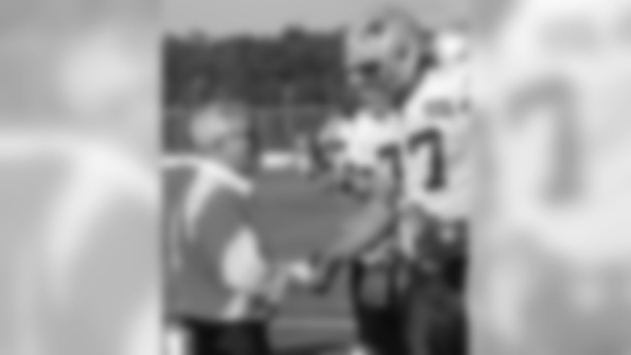 New England Patriots owner Robert Kraft, left, shakes hands with tackle Nate Solder during NFL football training camp in Foxborough, Mass., Thursday, Aug. 4, 2011. (AP Photo/Charles Krupa)