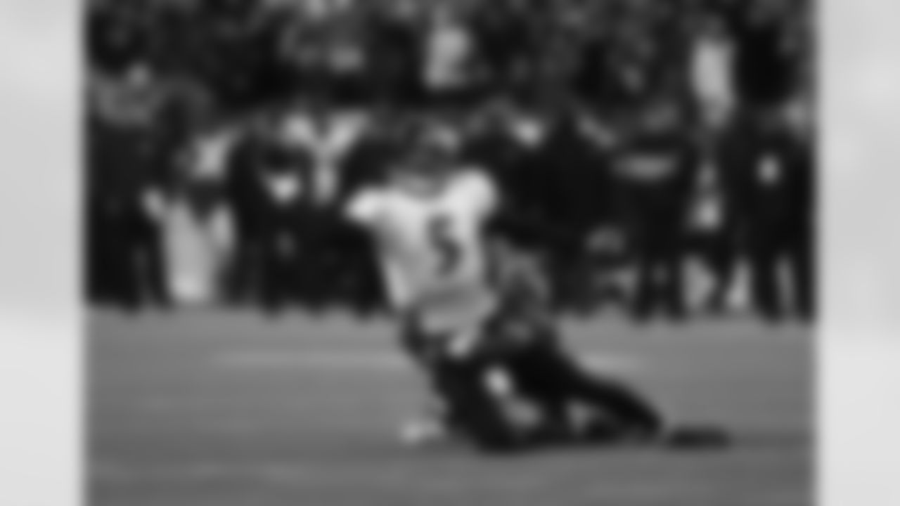 Baltimore Ravens quarterback Joe Flacco (5) throws before being sacked during an AFC Championship NFL football Playoff game against the New England Patriots on January 22, 2012