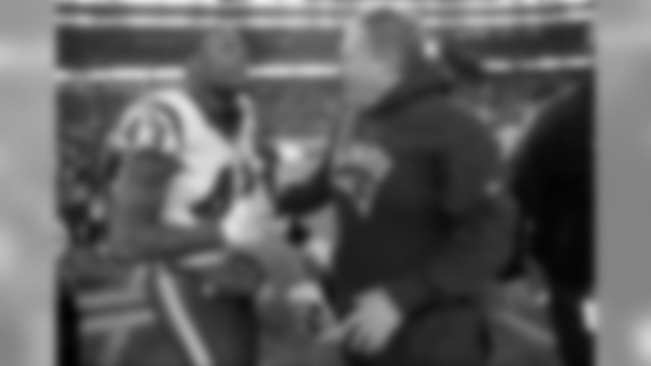 Houston Texans defensive back Corey Moore (43) and New England Patriots head coach Bill Belichick speak at midfield after an NFL divisional playoff football game, Saturday, Jan. 14, 2017, in Foxborough, Mass. (AP Photo/Elise Amendola)