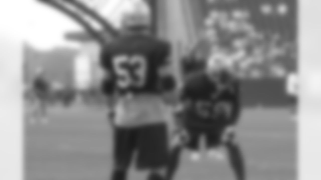 Patriots linebacker Rosevelt Colvin(59) and linebacker/special teams ace Larry Izzo(53) line up for a drill during the evening in-stadium practice on day 5 of Training Camp. 8/1/2006 Photo by Elizabeth Propper