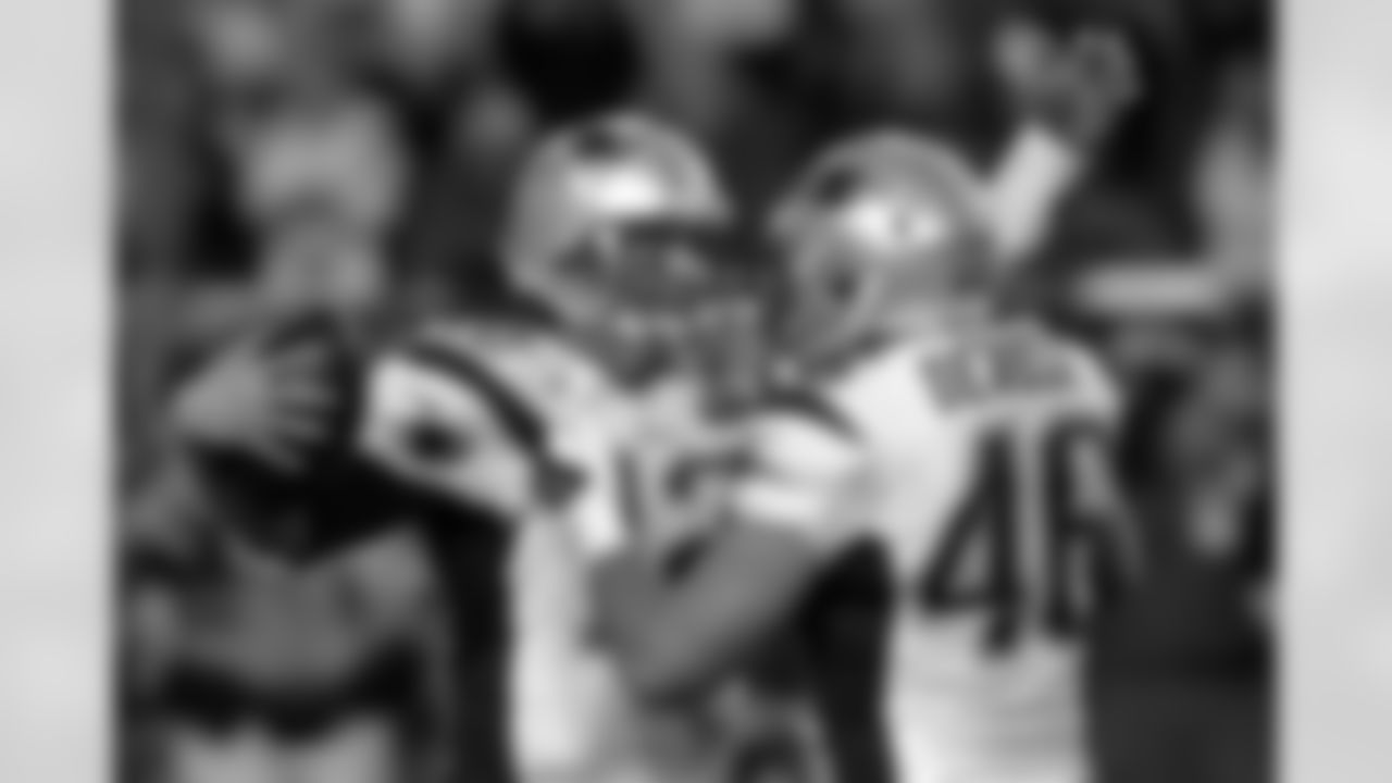 New England Patriots quarterback Tom Brady (12) celebrates with New England Patriots fullback James Develin (46) after NFL Super Bowl XLIX football game against the Seattle Seahawks Sunday, Feb. 1, 2015, in Glendale, Ariz. The Patriots won 28-24. (AP Photo/Patrick Semansky)