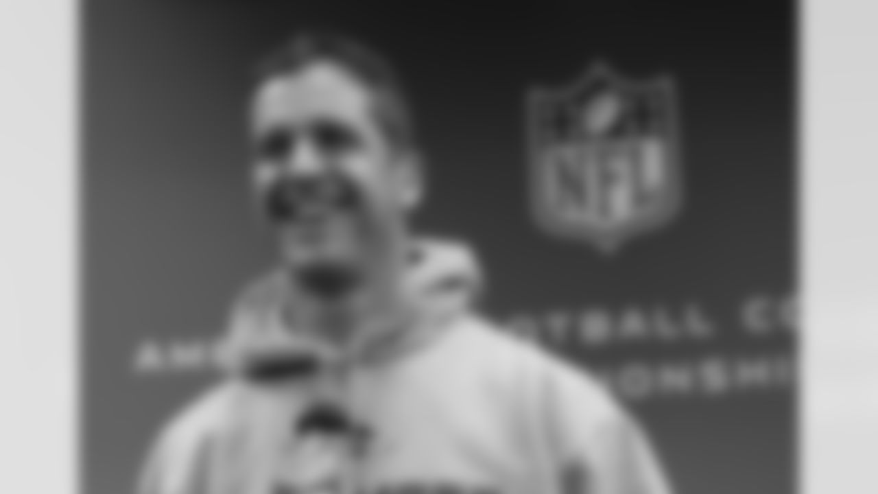 Ravens head coach John Harbaugh talks to media