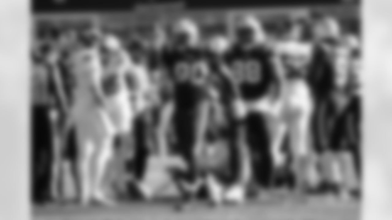 Christian Barmore (90) celebrates a sack